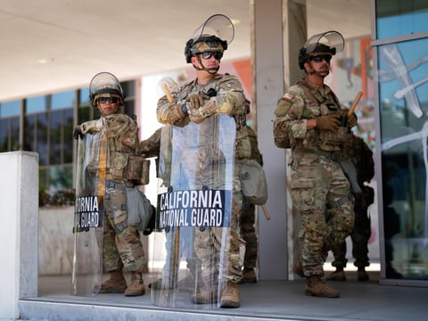 National Guard stand guard near the metropolitan detention center Monday, June 9, 2025, in downtown Los Angeles.
