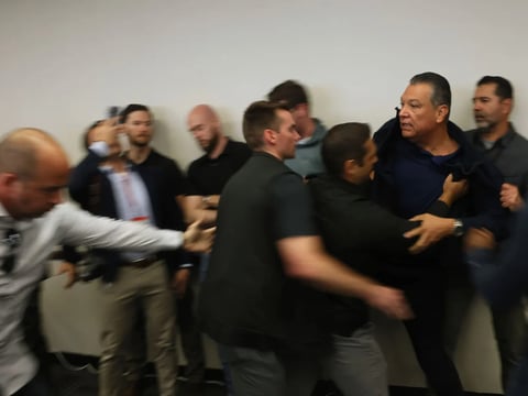 U.S. Sen. Alex Padilla is pushed out of the room as Homeland Security Secretary Kristi Noem holds a news conference regarding the recent protests in Los Angeles on June 12, 2025.