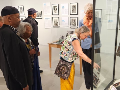 R.E. Malik Edwards (left), Kimberly Marshall (second from left), Susanna Lucia Lamaina (center) and Ericka Huggins (right) tour the new “Revolutionary Grain” exhibit at the California Museum June 14, 2025.