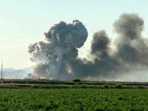 In this image taken from video, smoke and flames rise from a fireworks warehouse explosion on July 1 in Esparto, Calif.
