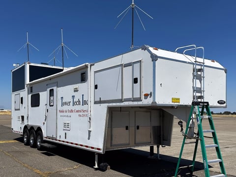 Tower Tech’s mobile air traffic control trailer sits near the runway at McClellan Airport on July 16, 2025. The trailer houses both a control tower and living quarters for seasonal operations.