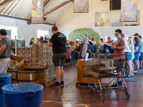 Volunteers of River City Food Bank distribute food to guests in their Arden-Arcade distribution site.