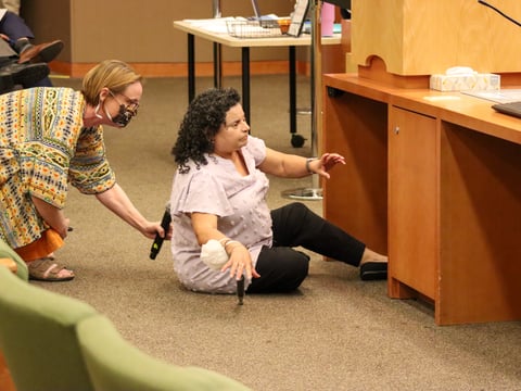 Regina Brink, a blind and disabled advocate, sits in protest next to the public comment podium at Sacramento City Hall on Tuesday, July 29, 2025. She remained there for more than two hours as the council debated a camping ban.