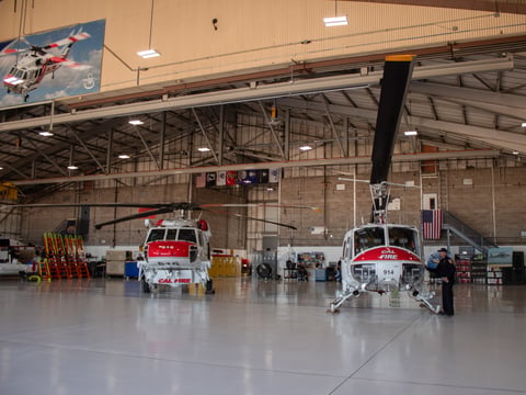 A Sikorsky S-70 Firehawk (left) next to a Huey Helicopter Thursday, July 31, 2025, at McClellan Airport in Sacramento.