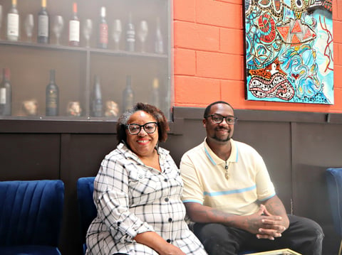 (L-R) Cynthia Dees Brooks and Jermaine Tilson inside the lounge area of TAP Wine Lounge on Friday, August 1.