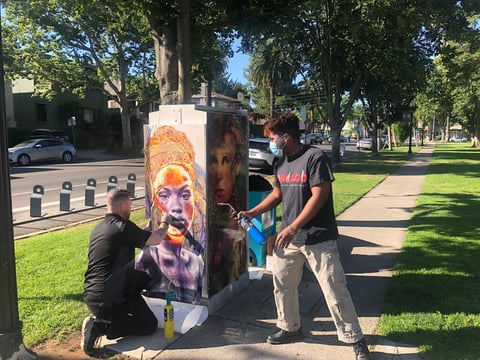“Art in Unexpected Places” provides beautification by having artists create in non-traditional urban locations, like this spray-painted utility box.