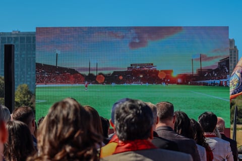 Fans and city officials watch new renderings of Republic FC’s planned Railyards stadium during the groundbreaking, Monday, Aug. 18, 2025.
