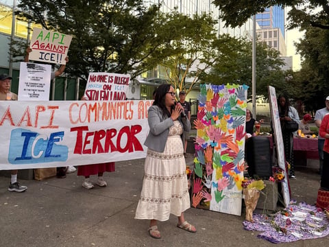 Protesters gather outside the John E. Moss Federal Building in downtown Sacramento for a vigil to raise awareness about how ongoing federal immigration actions are impacting Asian American and Pacific Islander communities Aug. 19, 2025.