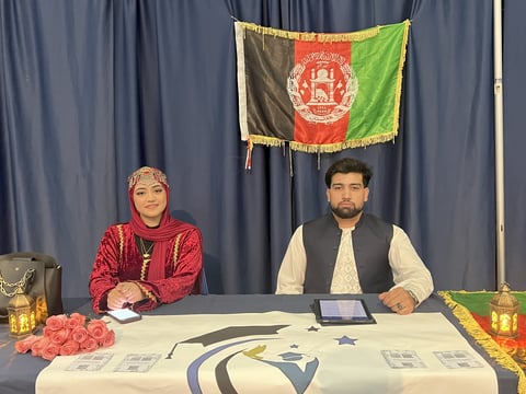 Vice President Robina Haqiqi (left) and President/Founder Walid Jailani (right) tabling at the UC Davis Afghan Cultural Banquet to raise awareness about The School of Freedom.