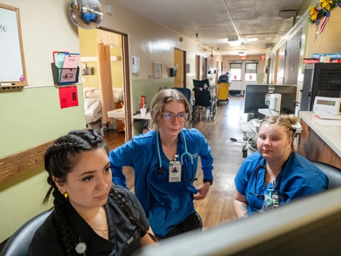 Licensed vocational nurse Jacqi Valdez, left, works with student vocational nurses Taylor Koutz, center, and Callie Baxter, right, at the Glenn Medical Center in Willows on June 13, 2025. Photo by Chris Kaufman for CalMatters