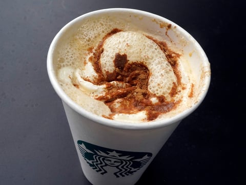 FILE -A Pumpkin Spice Latte drink rests on a table at a Starbucks in New York, Aug. 24, 2023.