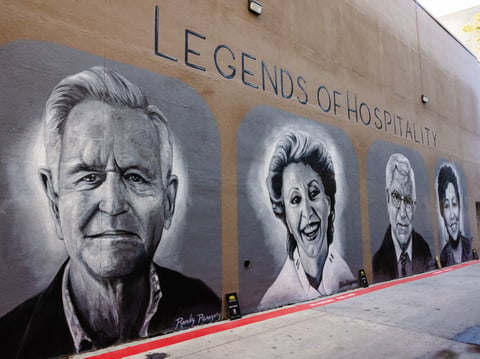“Legends of Hospitality” murals located in Downtown Sacramento's ‘Jazz Alley’ behind the Sheraton Grand Hotel. The mural was commissioned by Wide Open Walls. Sept. 15, 2025. (From left: Randy Paragary, Biba Caggiano, Darrell Corti, and Lina Fat.