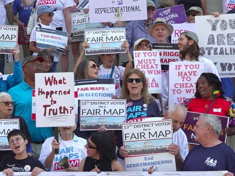 This photo taken from video shows organizers rallying outside of the Ohio Statehouse to protest gerrymandering and advocate for lawmakers to draw fair maps on Wednesday, Sept. 17, 2025, in Columbus, Ohio.