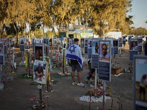 People visit the site of the Nova music festival, where hundreds of revelers were killed and abducted by Hamas and taken into Gaza, as Israel marks the second year anniversary of the attack, near Kibbutz Reim, southern Israel, Tuesday, Oct. 7, 2025. 