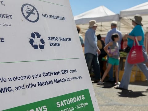 A sign welcoming CalFresh and EBT at the Ecology Center farmers’ market in North Berkeley on July 11, 2019.