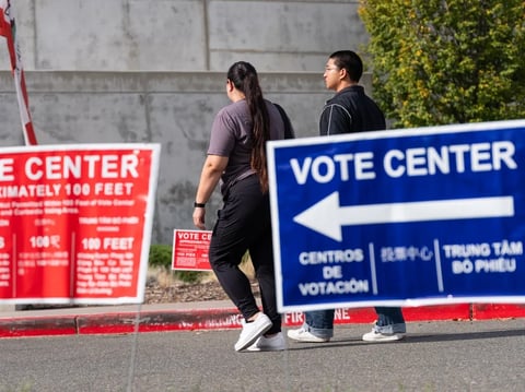 People walk by the vote center at Valley Ni-North Laguna Library in Sacramento on Nov. 4, 2025.