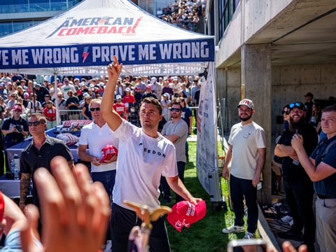 U.S. right-wing activist and commentator Charlie Kirk throws hats to the crowd shortly before he was fatally shot at a speaking event at Utah Valley University in Orem, Utah.