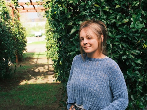 Krystal Keller Myers' daughter Kooper was assaulted at a party in Nevada County in August. She was hospitalized due to her injuries. Keller Myers stands in the CapRadio Garden in Sacramento, California on Dec. 17, 2025.