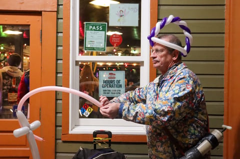Roy Ele twists balloon art outside Joe’s Crab Shack in Old Sacramento on Jan. 10, 2026. Ele is a longtime balloon artist and substitute teacher.