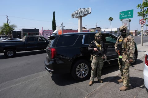 Immigration agents conduct an operation at a car wash, Aug. 15, 2025, in Montebello, Calif.