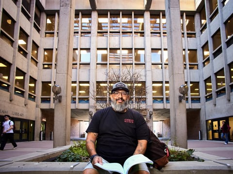 Oscar Deleon Jr., a student and Rapid Rehousing beneficiary, sits outside the Meriam Library at Chico State in Chico on Feb. 5, 2026.