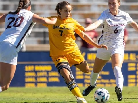 Golden Bears sixth-year forward Mia Fontana (center) battles against Virginia Tech players Oct. 12, 2025 at Edwards Stadium.