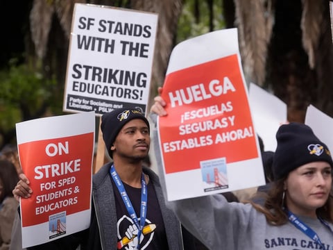Teachers, students and supporters picket outside of Mission High School in San Francisco, on Feb. 9, 2026.