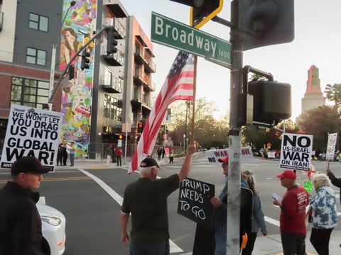 Anti-Iran War protesters gather Monday, March 2, 2026, on the corner of Broadway and 16th Street in Sacramento.