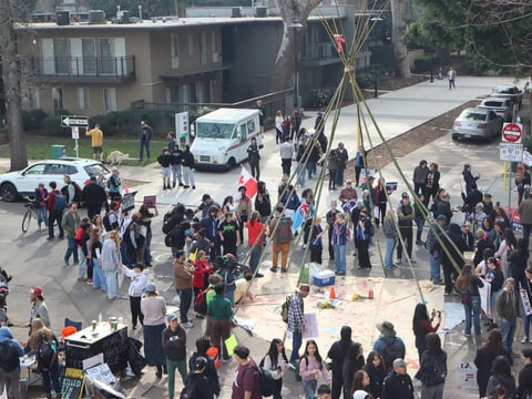 Sacramento students gather around Sierra Rose Feay's tipi on Jan 30. during a citywide walk out against Immigration enforcement. Protestors help set it up for a four-day religious ceremony that would later be interrupted by Sacramento PD.
