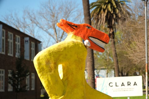 "Homie, Walking the Dogs" by Gilbert “Magu” Lujan outside the CLARA Studios for the Performing Arts. Photo by Ruth Finch