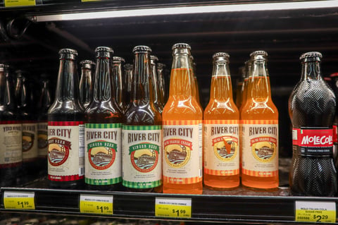 Bottles of River City Root Beer sit on a refrigerator shelf at Corti Brothers grocery store in East Sacramento on Wednesday, Feb. 25, 2026.