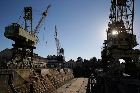 In this photo taken Oct. 2, 2014, the sun begins to go down behind the former Mare Island Naval Shipyard in Vallejo, Calif. The city of Vallejo, which emerged from bankruptcy five years ago, is poised to get a big economic boost as plans to build a m