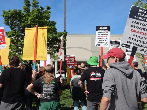 Parents and teachers protest at the Natomas Unified School District Office Tuesday morning. A parent was arrested for trespassing while the office was closed to the public.