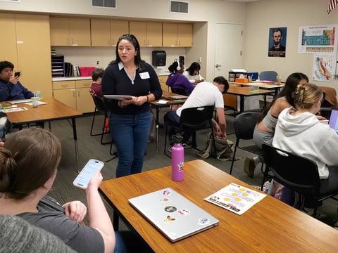 Executive director Clarissa Laguardia of The California Center for Civic Participation, helps a student register to vote after giving a presentation on voter registration at Natomas Charter High School on Wednesday, Feb. 4, 2026.
