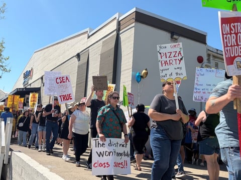 Teachers and supporters rally outside the Twin Rivers Unified School District offices in McClellan Park, Calif., on Friday, March 20, 2026, the 12th and final day of the strike.