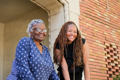 Mother and daughter duo Dorothy and Michelle Benjamin pose outside the former Oak Park Library March 23. The library is now the IT Help Department Office for McGeorge School of Law.