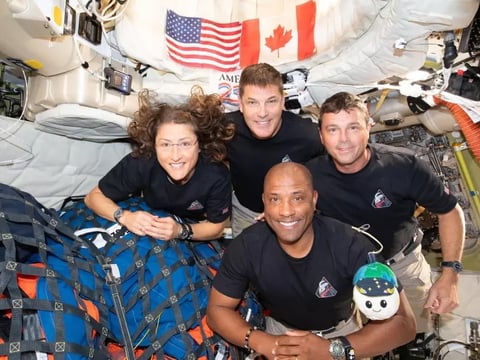 The Artemis II crew — Christina Koch (left), Jeremy Hansen, Victor Glover and Reid Wiseman — are seen on the Orion spacecraft on their way home. Photo courtesy NASA
