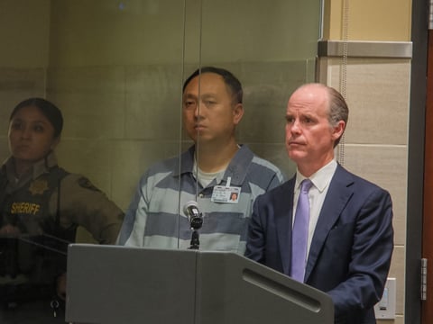 Kenneth Chee (center), owner of Devastating Pyrotechnics, makes his first appearance in Yolo County court after being indicted in connection to the deadly July 1 Esparto fireworks explosion Thursday, April 23, 2026 in Woodland.