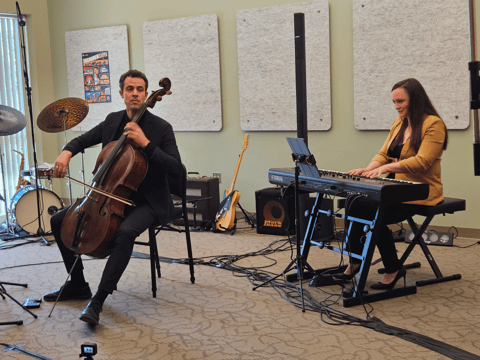Cellist Mike Dahlberg performing with Jennifer Reason during a live concert recording of the 100th episode of the Local Artist Feature at CapRadio. Photo by Sarit Laschinsky