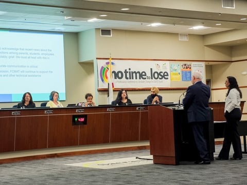 Michael Fine stands at a podium and gives a presentation to the Sacramento City Unified School District on May 7th, 2026.