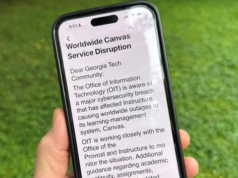 An image of a notice sent by Georgia Tech's information technology department warning students, professors and staff about the cybersecurity breach of the Canvas system it uses for assignments and grading is displayed on a phone, Friday, May 8, 2026.
