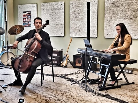 Cellist Mike Dahlberg performing with Jennifer Reason during a live concert recording of the 100th episode of the Local Artist Feature at CapRadio. Photo by Sarit Laschinsky