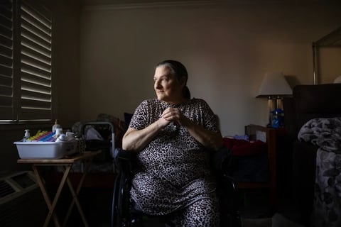 Resident Sherry Collins, 66, inside her room at Live Oak Apartments in Ukiah on Feb. 26, 2026. Photo by Manuel Orbegozo for CalMatters