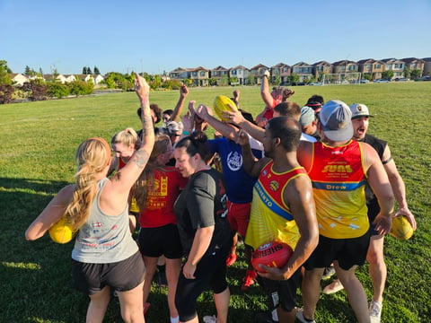 The Sacramento Suns gather for a huddle during a practice on Wednesday, April 29, 2026 at Airfield Park in Natomas. (Sarit Laschinsky/CapRadio)