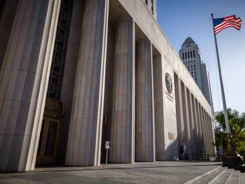 An American flag waves outside the Los Angeles Superior Court in Los Angeles on Feb. 11, 2026.