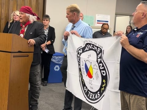 Richard Gonzalez, chief of the Lipan Apache Band of Texas, presented the tribe’s flag to Sanger High School on May 26, 2026, after the school obtained permission to continue using the Apache as its name and mascot.