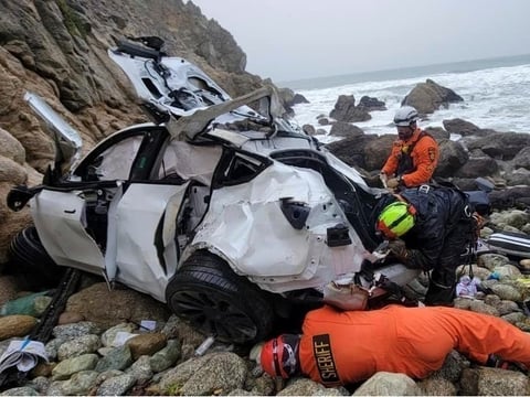 FILE - In this photo provided by the San Mateo County Sheriff's Office, emergency personnel respond to a vehicle over the side of Highway 1 on Jan. 1, 2023, in San Mateo County, Calif.