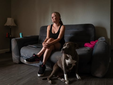 Jessica Scott, 35, and her pitbull, Baby Girl, inside their new apartment in Sacramento on July 1, 2026.