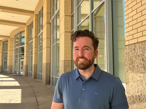 Sacramento resident Alex Enright poses outside city hall, one of the places he used to sleep when he was homeless, on July 6, 2026.