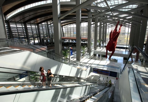 In this Thursday, Sept. 29, 2011 photo, people ride an escalator to the third floor of the new Terminal B at the Sacramento International Airport.